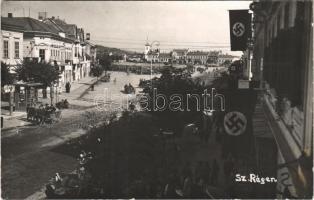 1940 Szászrégen, Reghin; bevonulás, német náci szvasztika zászlók, katonai teherautók a Fő téren, benzinkút / entry of the Hungarian troops, Nazi swastika flags, military trucks on the main square, gas station. original photo + &quot;1940 Szászrégen visszatért&quot; So. Stpl