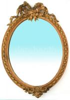 Klasszicista ovális tükör metszett üveggel, aranyozott, faragott fa kerettel. Kis sérülésekkel a faragásokon. Külső méret 57x84 cm / Oval mirror with hand carved frame 57x84 cm