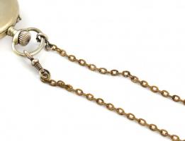 Alex Hüning Gen?ve zsebóra fém tokkal, számlapon kis elszineződés, működő, jó állapotban. Hozzá fém ...