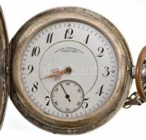 A. Lange & Söhne ezüst (Ag) zsebóra. Jelzett tok, jelzett szerkezet. (szerkezetszám: 54618) Dupla ezüst tok. Egy mutató és az üveg nélkül, de működő, szép állapotban, hibátlan számlappal. Ezüst óraszíjjal d: 50 mm / Silver A. Lange & Söhne pocket watch. Marked case and mechanics One dial and glass missing otherwise in good condition Works well. with silver watch chain d: 50 mm