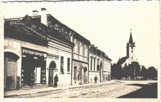 1940 Szászrégen, Reghin; utca, templom, Philippi & Langer könyvkiadó üzlete és saját kiadása / street, church, printing shop