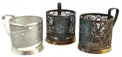 3 db fém szovjet pohártartó füllel: 2 db a felszabadulás 30. évfordulójára, áttört, jelzett, hibátlan, m: 8 cm, d: 7 cm + Űrhajózás motívummal díszített, apró kopásnyomokkal, d: 7 cm, m: 6,5 cm