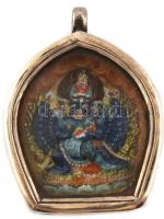 Tibeti cserép istenség amulet. Kézzel festett, fém keretben, nyakba akasztható. 4,5x3,5 cm