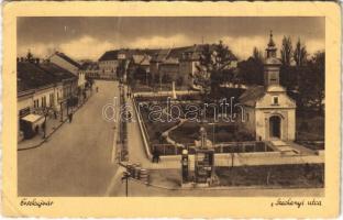 1942 Érsekújvár, Nové Zámky; Széchenyi utca, templom, üzletek, utcai benzintöltő állomás. Jaksics Ferenc kiadása / street view, church, shops, petrol pump, gas oil station (RB)