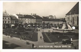 1942 Kolozsvár, Cluj; Mátyás király tér, üzletek, automobil / square, shops, automobile (lyukasztott / punched hole)