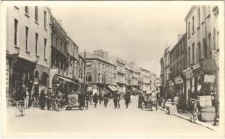 Tipperary (?), Street, shops, automobiles. photo