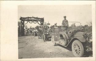 1916 Chervonohrad, Krystynopol; WWI Austro-Hungarian K.u.K. military, soldiers in automobiles, decorated gate with Viribus Unitis sign. photo