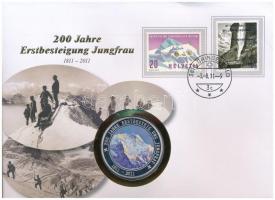 Svájc 2011. A Jungfrau megmászásának 200. évfordulója kétoldalas Cu-Ni multicolor emlékérem, felbélyegzett borítékban, elsőnapi bélyegzéssel T:1 (eredetileg PP) fo. Switzerland 2011. 200th anniversary of the climb of the Jungfrau mountain two-sided Cu-Ni multicolor medallion in envelope with stamp and first day cancellation C:UNC (originally PP) spotted