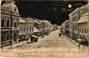 1904 Nyitra, Nitra; Tóth Vilmos utca, este, Weisz Lipót üzlete / street and shops at night (EK)