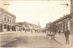 Losonc, Lucenec; Gácsi utca, üzletek. Vasúti levelezőlapárusítás 1906. / street view, shops (EK)