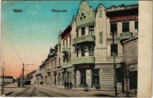 Budapest IV. Újpest, Károly utca, Angyal gyógyszertár, Minta zene iskola, villamos. Selley Károly fényképész kiadása (Rb)