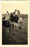 1940 WWII German military, soldiers unloading carts. photo