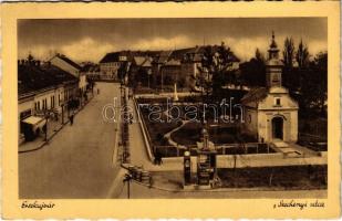 1940 Érsekújvár, Nové Zámky; Széchenyi utca, benzintöltő állomás, üzletek, templom / street view, petrol pump, gas oil station, shops, church (EK)