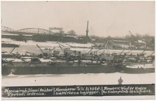 Komárom, Komárnó; téli kikötő, háttérben a hajógyár, uszályok, "OREL" típusú lapátkerekes ingahajó / winter port, barges, ship factory, ships. photo