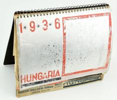 1936 Hungaria asztali naptár, négynyelvű, fekete-fehér fotókkal illusztrált. Bp., M. Kir. Külkereskedelmi Hivatal. Spirálfűzött, kopott, sérült, 25x21 cm