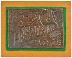 1982. 1912-1982 70 év Egri Vasöntöde öntött Br plakett fa talpon (81x111mm) T:2 több kisebb festékfolt