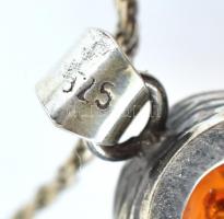 Ezüst(Ag) csavart nyaklánc borostyán medállal, jelzett, nyaklánc javított, h: 44 cm, bruttó:12,54 g