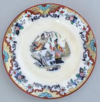 Távol-keleti mintával díszített süteményes tányér. Részben kézzel festett, benyomott jelzéssel, mázrepedésekkel, kopásnyomokkal, d: 17,5 cm