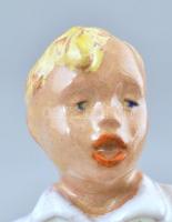 Olvashatatlan jelzéssel: Art Deco harmonikázó fiú. Mázas kerámia, kopásnyomokkal, m:14,5cm