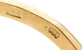 Arany (Au/18k) Női gyűrű, 1db természetes smaragddal ékítve cca. 0,30ct, 1db modern csiszolású brill...