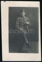 cca 1914-1920 I. világháborús magyar tiszt egyenruhában, karddal, fotó, 10,5x7 cm