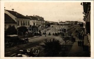 1940 Szászrégen, Reghin; utca, üzletek, automobil, benzinkút / street view, shops, automobiles, petrol pump, gas station
