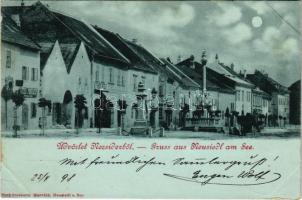 1898 (Vorläufer) Nezsider, Neusiedl am See; Strasse am Nacht / utca este, Michl Fröhlich és Franz Wolf üzlete / street, night, shops