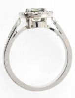 Arany (Au/14k) női gyűrű, fehérarany, 18 db brillel ékítve (0,34ct/TW, vs1) és 1 db kerek fazettált,...