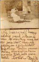 1911 Pécel, Péczel; padon ülő hölgy. Díjjegyes lapra ragasztott fotó. photo (EK)