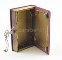 Könyvalakú, vászonkötésű, német gyártmányú (John J. Moser Berlin), gazdagon díszített fém persely &q...