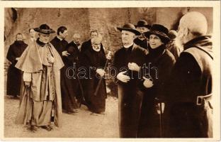 His Emin. Card. Archbishop Hayes of New York entering the Catacombs of St. Callistus to celebrate Mass in the Crypt of the Popes. At the right, the daughter of the renowned De Rossi, discoverer of the Crypt