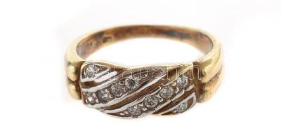 Arany (Au) 14 K apró kövekkel díszített szalagos gyűrű, jelzett, méret: 49, bruttó: 3,4 g