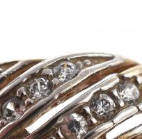 Arany (Au) 14 K apró kövekkel díszített szalagos gyűrű, jelzett, méret: 49, bruttó: 3,4 g