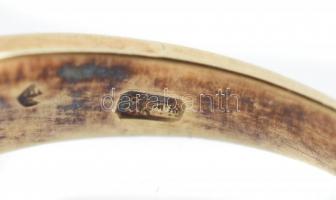 Arany (Au) 14 K apró kövekkel díszített szalagos gyűrű, jelzett, méret: 49, bruttó: 3,4 g