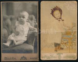 cca 1890-1910 Babafotók, 2 db keményhátú fotó Mai és Társa, ill. Mérei és Társa budapesti műterméből, vizitkártya, az egyiken utólagos színezéssel, sérült, 10,5x6,5 cm