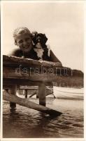 Hölgy fürdőruhában a strandon kis kutyával / Lady in bathing suit with dog. photo