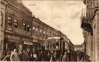 Újvidék, Neusatz, Novi Sad; Duna utca villamossal, Gortán és Donáti üzlete, Singer J. udvari fényképész irodája és saját kiadása / street view with tram and shops (EK)