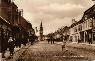 1927 Nagyszombat, Tyrnau, Trnava; Masarykova ulica / Masaryk utca, üzletek, autóbusz / street view, shops, autobus