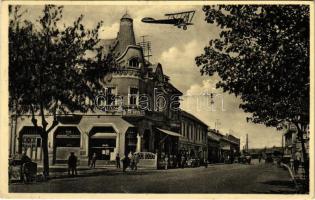 1935 Losonc, Lucenec; Kavarien Corso / Corso kávéház, Schultek órás és ékszerész, repülőgép az utca fölött / cafe, shops, street, aircraft (EK)