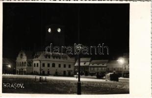 Brassó, Kronstadt, Brasov; Városháza télen este, drogéria, Tellmann & Woget, Viktor Butyka, Wilh. Hiemisch üzlete, gyógyszertár / town hall in winter at night, shops, pharmacy. photo