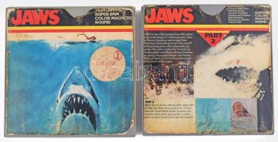 cca 1975 A cápa (Jaws) c. klasszikus amerikai horrorfilm (rendezte: Steven Spielberg), I-II. rész, 8 mm-es Super 8 filmen, eredeti, kissé viseltes műanyag tokban / Jaws (directed by Steven Spielberg), Part I-II, classic American horror movie on 8mm Super 8 film, in slighty worn original cases