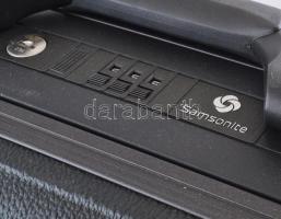 Samsonite nagy méretű bőrönd, számzáras, húzható gurulós. 67x53 cm Jó állapotban, kicsi kopással