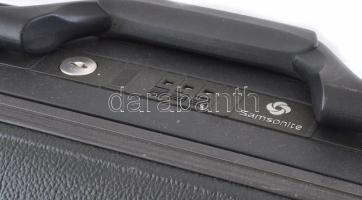 Samsonite nagy méretű bőrönd, számzáras, húzható gurulós. 60x50 cm Jó állapotban, kicsi kopással