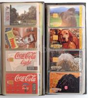 66 db különféle telefonkártya, két albumban