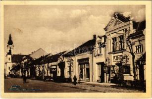 1943 Hódság, Odzaci; Fő utca, Neumajer Péter üzlete, mozi / Glavna ulica / Hauptstrasse, Kino / main street, shop, cinema (EB)