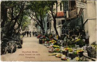 Hong Kong, Hongkong; Wyndham Street where flowers are sold, William Powell Ltd. Dressmakers & Milliners (EK)