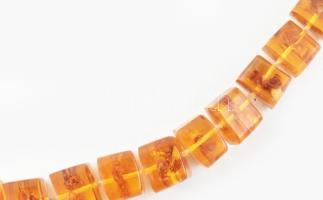 Borostyán jellegű nyakláncok elszakadva