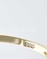 Arany (Au) 14K sárgaarany gyűrű akvamarinnal (1 ct) és 6 db brill
berakással. Bruttó 3.1g, 64-es mé...