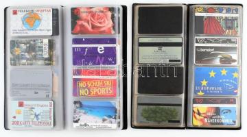 112 db magyar és külföldi telefonkártya 2 db kártyatartóban