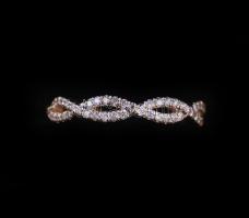 Arany (Au) 14K rosegold fonott gyűrű gyémántokkal kirakva, 0,51 ct, méret: 53, bruttó: 2,41 g